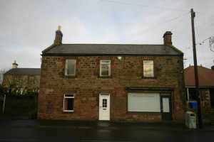 Old shop window with sagging lintel